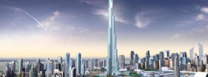 Tall modern skyscraper in a city skyline during sunset.