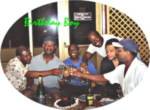 A group of friends enjoying drinks together at a table.