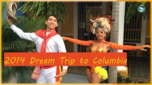 A poster for a Columbia trip with two people wearing traditional costumes